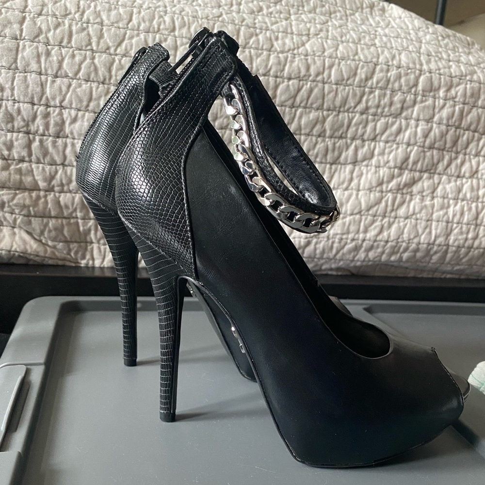 Jennifer Lopez black peep toe heel with ankle strap. US 6